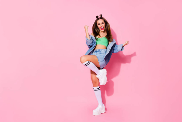 Full length body size view of nice-looking attractive lovely glamorous trendy casual glamour slim fit tanned glad cheerful lucky girl having fun rejoicing isolated over pink pastel color background - Foto, Imagem