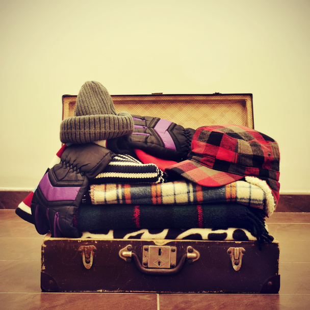warming clothes in a suitcase - Photo, Image