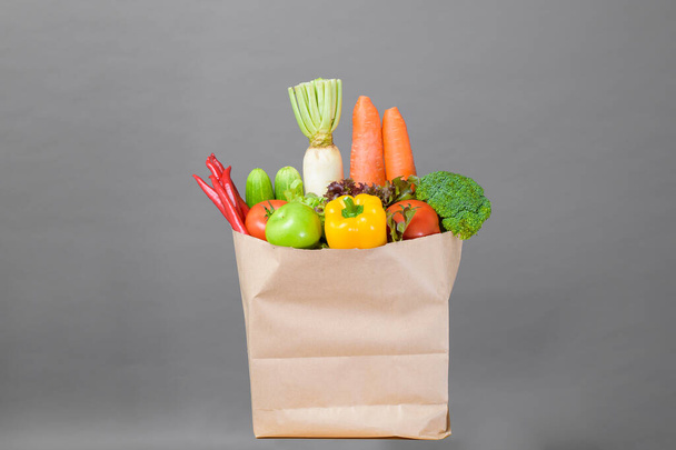  vegetables in grocery bag on studio grey background - Valokuva, kuva