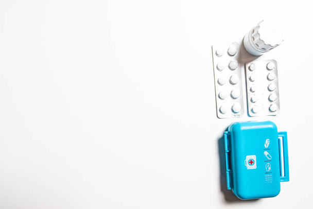 different medicine pills in packs on white desk - Foto, Bild