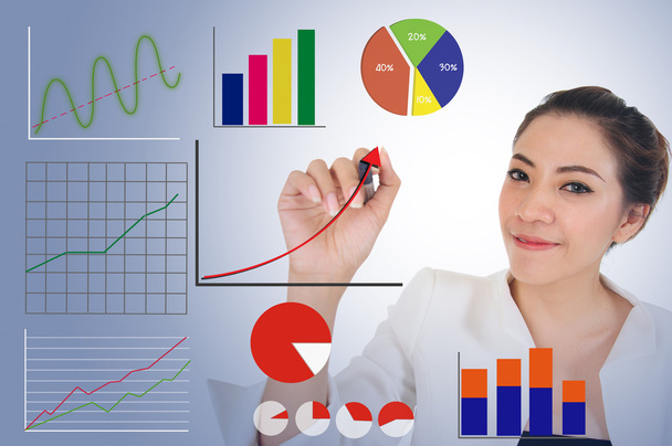Business woman drawing raising graph to present good performance - Photo, Image