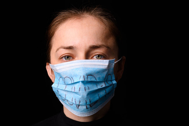 Female Medical Worker Wearing Protective Face Mask. Covid-19 protection. - Фото, зображення