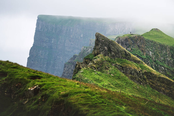 Foggy view of gorgeous mountains of Mykines island - Foto, Imagem