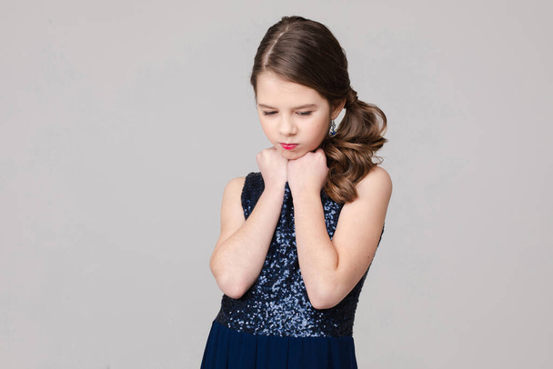 Portrait of beautiful young girl is sad, picture isolated on white background - Photo, Image