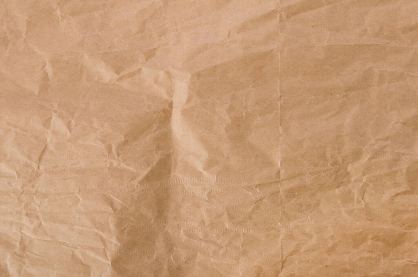 Verfrommeld ambachtelijk papier achtergrond textuur - Foto, afbeelding