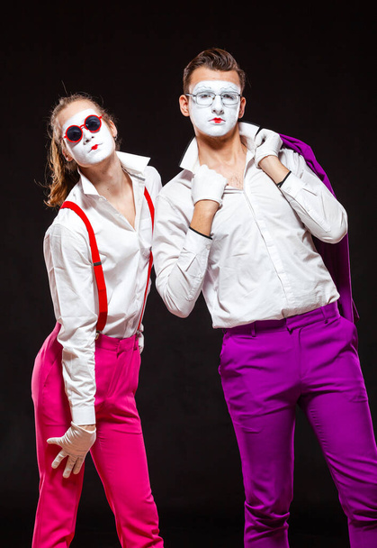 Portrait of male mime artists, isolated on black background. Two man are posing for camera. Symbol of friendship, lovers, tolerance, LGBT - Foto, imagen