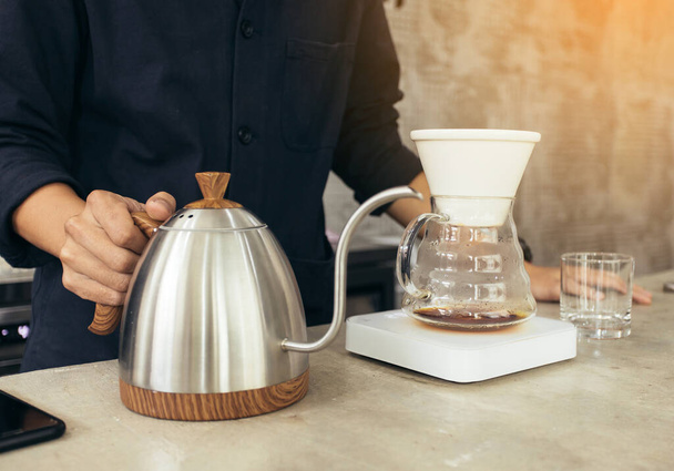 Barista brewing coffee, method pour over, drip coffee - Photo, image