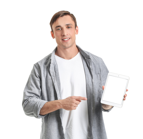 Young man with tablet computer on white background - Fotografie, Obrázek