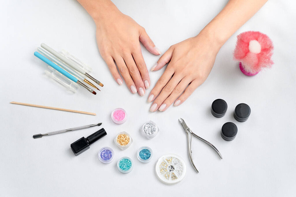 Image of nail art tools and hands - Photo, Image