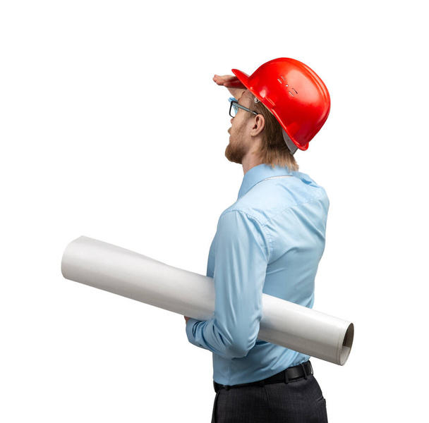 portrait one smart architect worker or engineer man in red construction helmet with drawing - draft, on white background, isolated - Fotografie, Obrázek