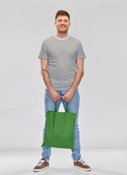 man with reusable canvas bag for food shopping - Φωτογραφία, εικόνα