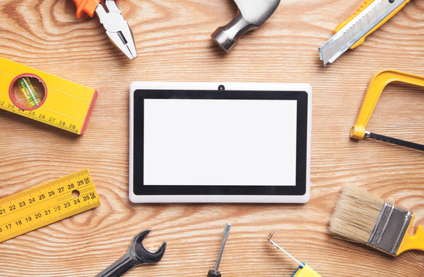Work tools with tablet on wooden background. Empty screen for your text - Valokuva, kuva