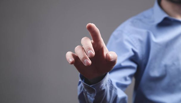 Man pointing or touching finger in screen.  - Photo, Image