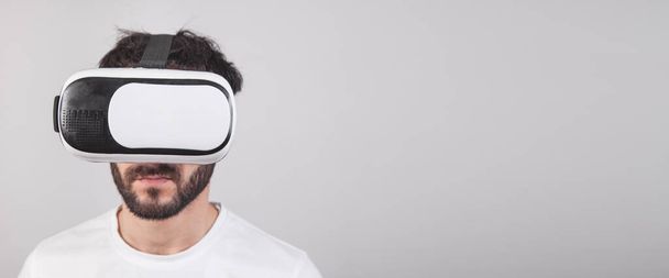 Man wearing virtual reality goggles. Space for your text - Photo, image