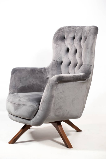A grey comfortable armchair isolated on a white background - Valokuva, kuva