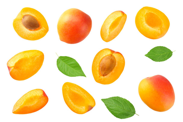 apricot fruits with slices and green leaf isolated on white background. top view - Φωτογραφία, εικόνα