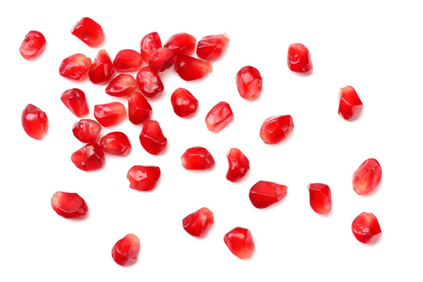 pomegranate seeds isolated on white background. top view - Foto, afbeelding