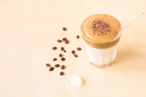 Dalgon coffee in a transparent glass on a wooden background. - Photo, image
