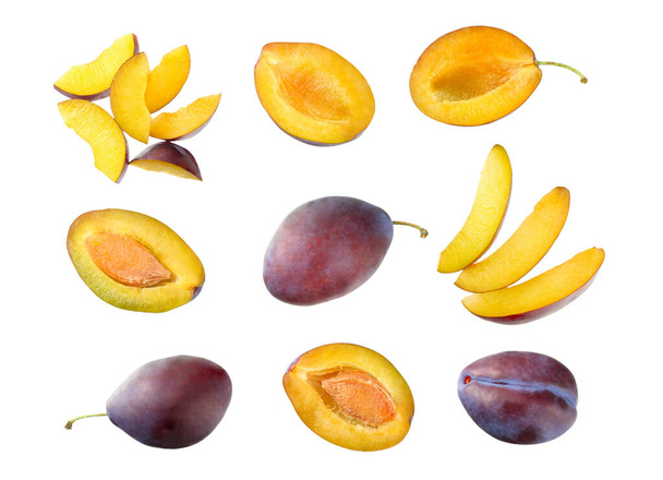 fresh plum fruit with cut plum slices isolated on white background. top view - Foto, Imagem