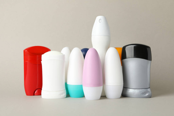 Group of body deodorants on gray background, blank space for text - 写真・画像
