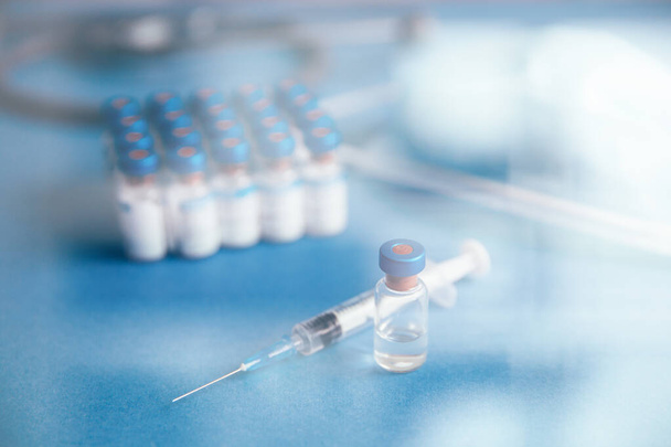 Vaccines bottles and syringe. Medical objects.  - 写真・画像