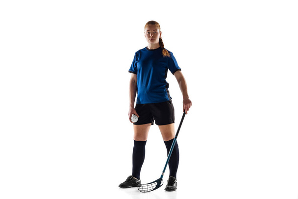 Floorball female player isolated on white studio background, action and motion concept - Фото, зображення