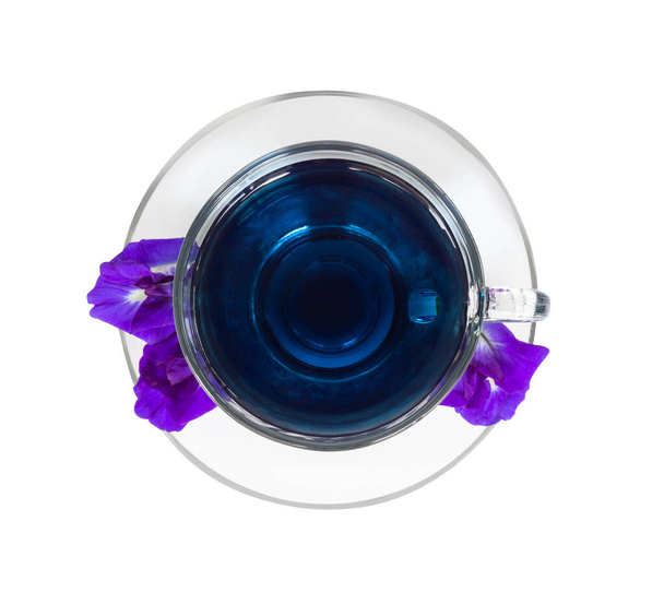 Glass of butterfly pea juice on white background, herb and medical concept - Photo, Image