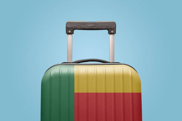 Suitcase with Benin flag design travel Africa concept. - Foto, imagen
