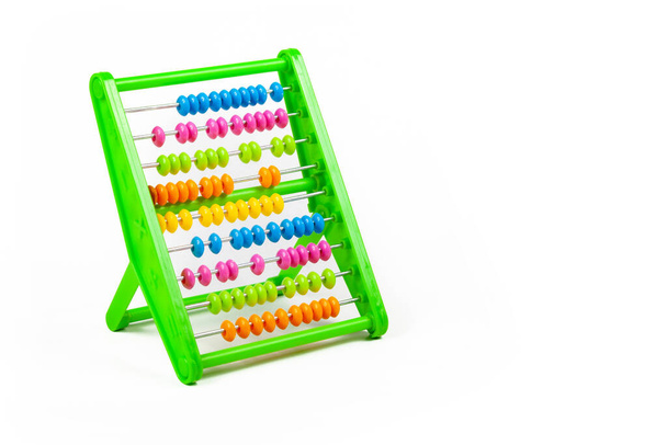Colorful abacus tool, toy object isolated on white background, cut out Beads randomly aligned Teaching children math, kids elementary mathematics and counting education simple abstract concept, symbol - Photo, Image