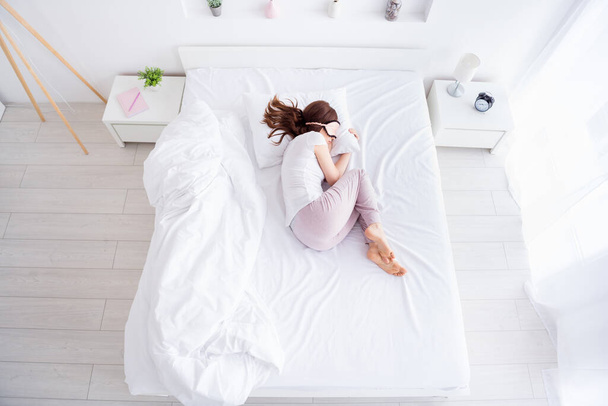 Top above high angle view of her she nice attractive red haired girl lying in bed sleeping day time loneliness psychology in modern white light interior style room house apartment hotel - Fotoğraf, Görsel
