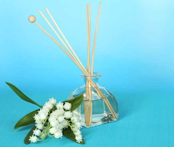 Aromatic sticks for home with floral odor on blue background - Фото, зображення