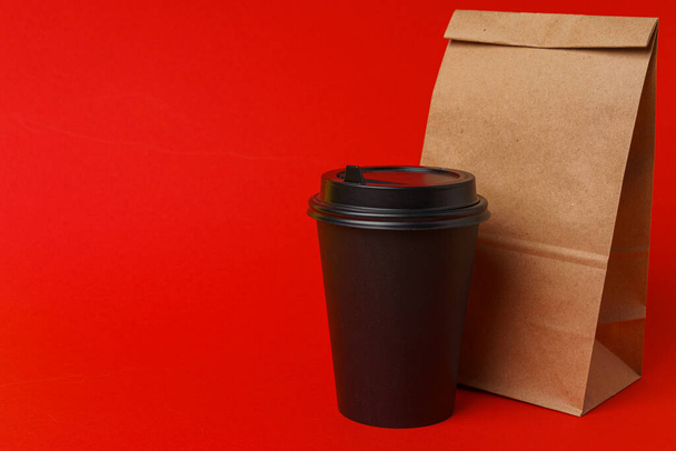 Takeaway food concept. Some packed food in container with coffee cup - Photo, Image