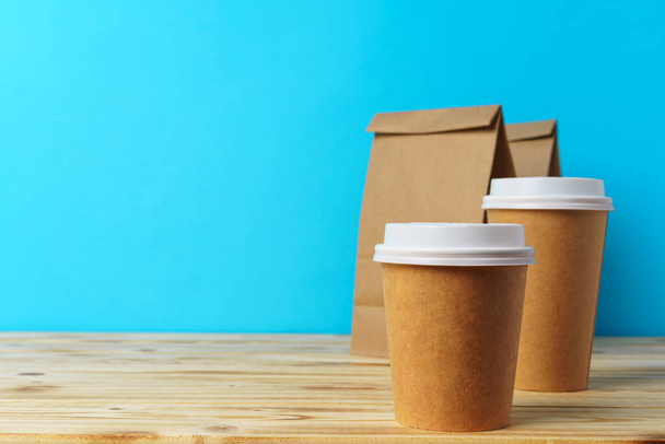 Paper bags with take away food and coffee cups containers - Фото, зображення