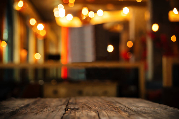 wood table on blur backgroun of club or restaurant - Photo, image