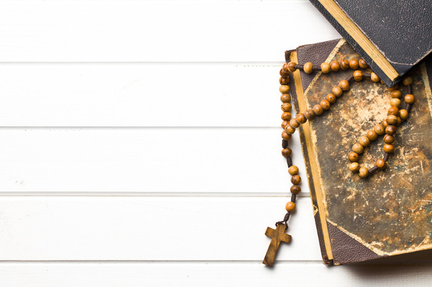 Wooden rosary beads with old book - Photo, image