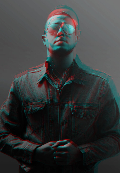 Portrait of a young man in sunglasses and jeans jacket. Image with anaglyph effect. - Foto, Bild