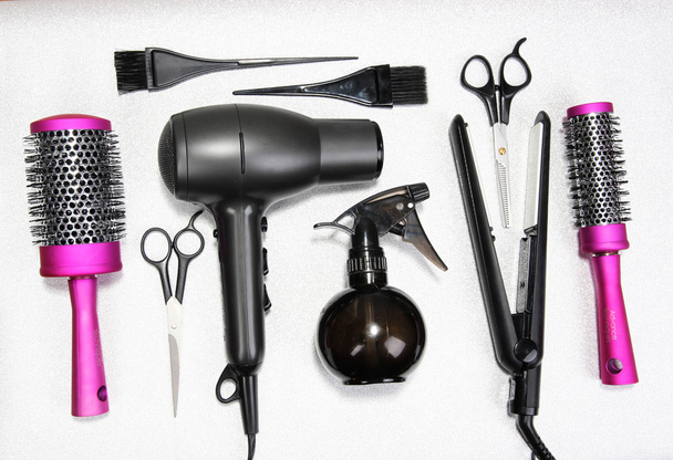 Hairdressing tools on silver background - 写真・画像