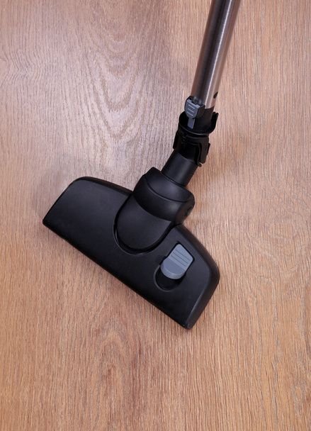 Vacuuming floor in house - Фото, изображение
