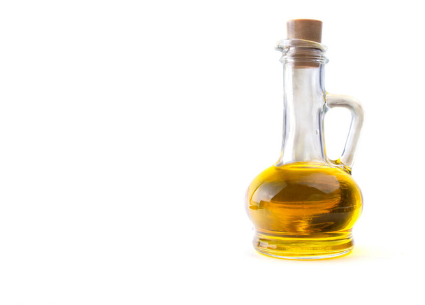 bottle with sunflower seed oil on a white isolated background, close-up - Foto, Imagen