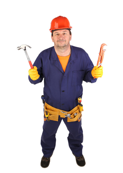 Worker in hard hat holding hammer - Фото, зображення