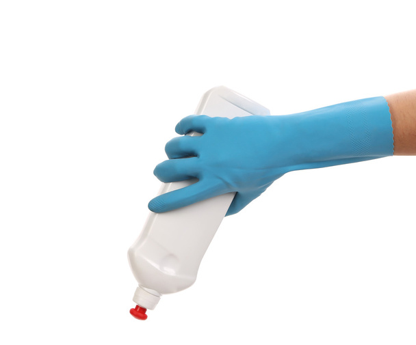 Hand in glove holding white plastic bottle. - Foto, Imagem