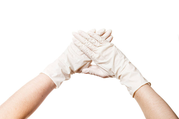 két kéz egy orvosi steril kesztyű mutatja csukló előtted, közelkép koncepció mock elszigetelt fehér háttér. - Fotó, kép