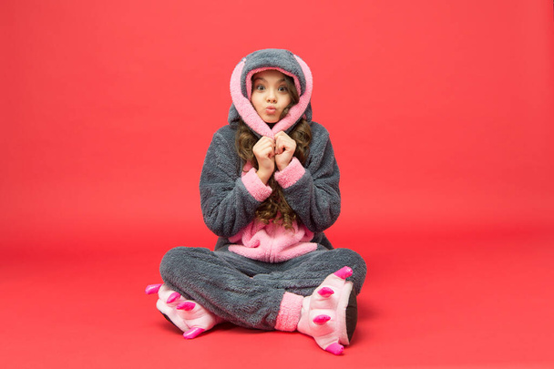 Cozy pajamas. Clothes shop. Domestic clothes. Easter day. Rest and relax. Cute bunny kid. Baby animal character. Girl in bunny costume. Child rabbit kigurumi. Happy girl bunny pajamas - Photo, image