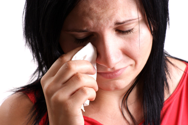 A young woman is sad and crying - Φωτογραφία, εικόνα