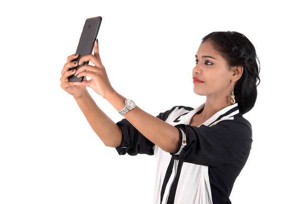 business woman using a mobile phone or smartphone isolated on a white background - Foto, Imagen