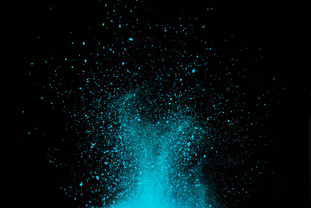 Explosion of blue, aqua and violet dust on black background. - Foto, Imagem