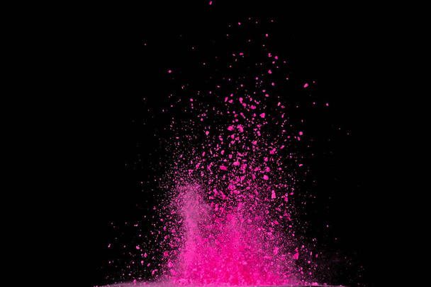Pink powder explosion on black background. Colored cloud. Colorful dust explode. Paint Holi. - Photo, Image