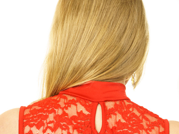 Unrecognizable woman wearing red top with laced detail on back. Fashion, clothing style concept. - Photo, image