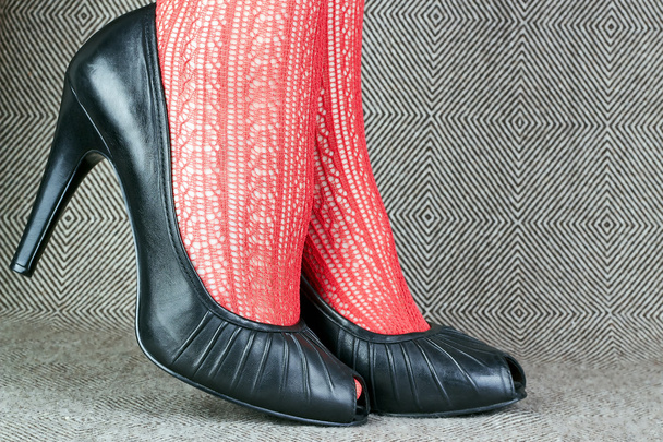 black leather shoes with red tights - Photo, Image