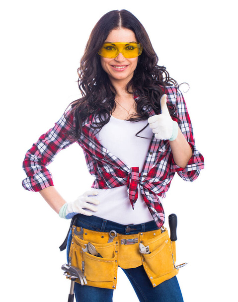 Project Satisfaction. Sexy brunette woman mechanic with yellow safety glasses, isolated over white background - Foto, afbeelding